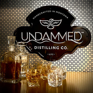 Undammed Distilling Co Tin Tacker