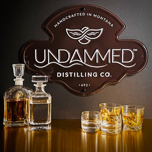 Undammed Distilling Co Tin Tacker